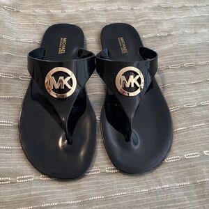 Michael Kors Glossy Black Sandals with Gold Emblem